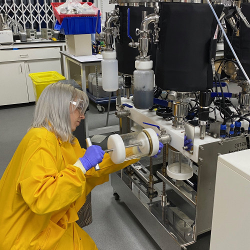 An image of a scientist working with the batch BMP system