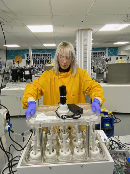 An image of a scientist working with the batch BMP system